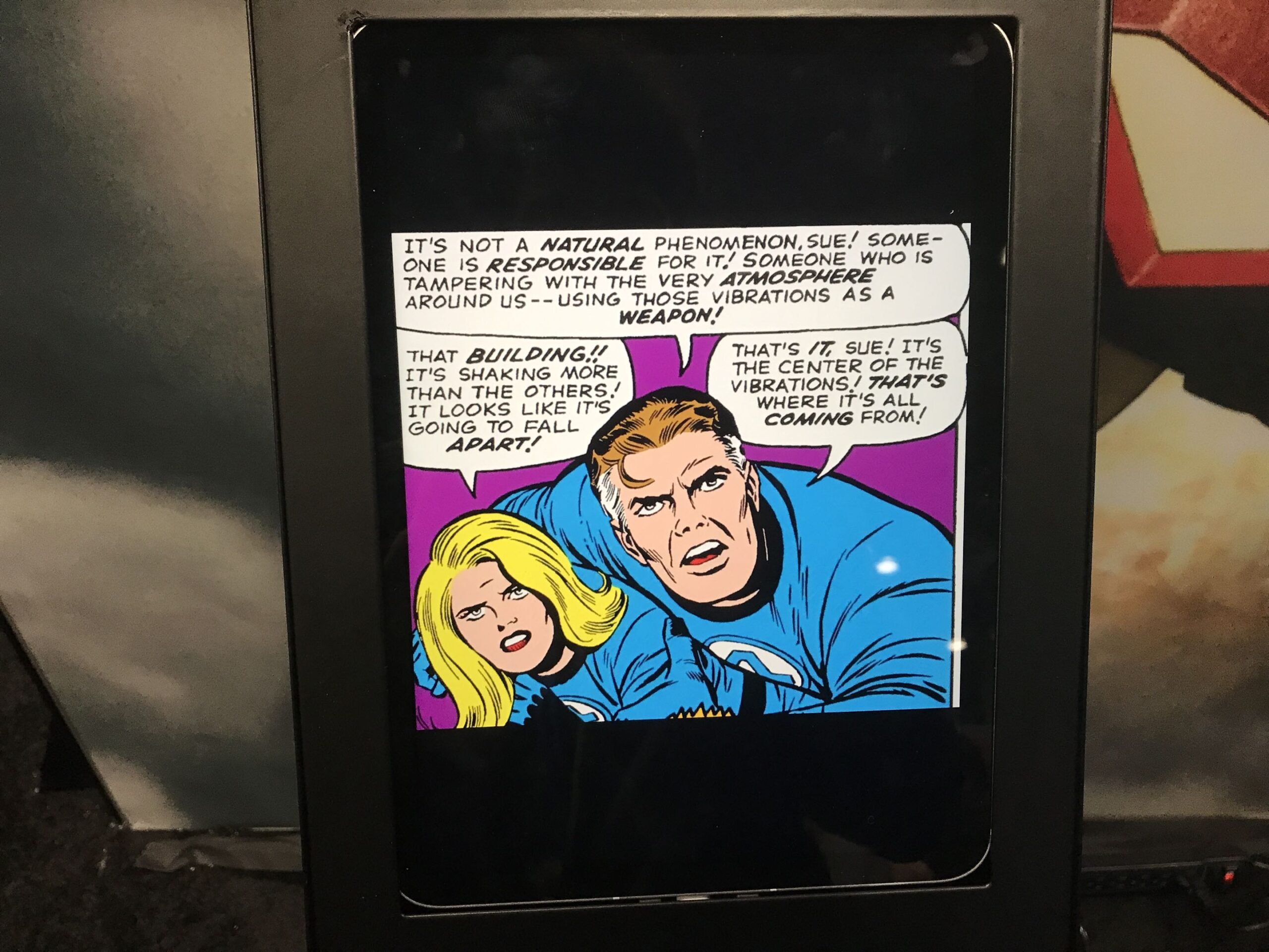 one of the panels from a Fantastic Four issue on full display within a tablet's screen through the Marvel Comics app.